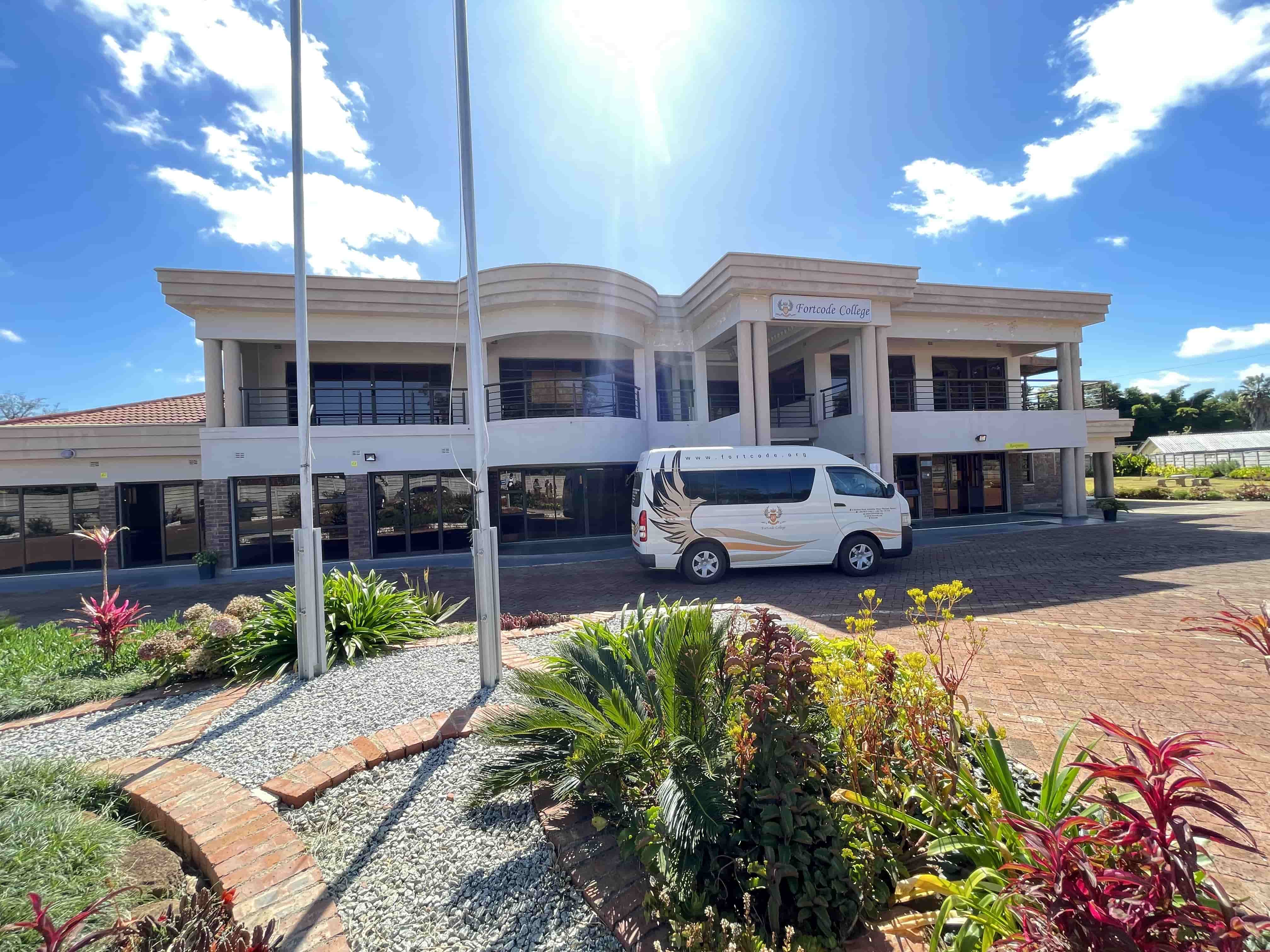 Fortcode College bus in front of the school